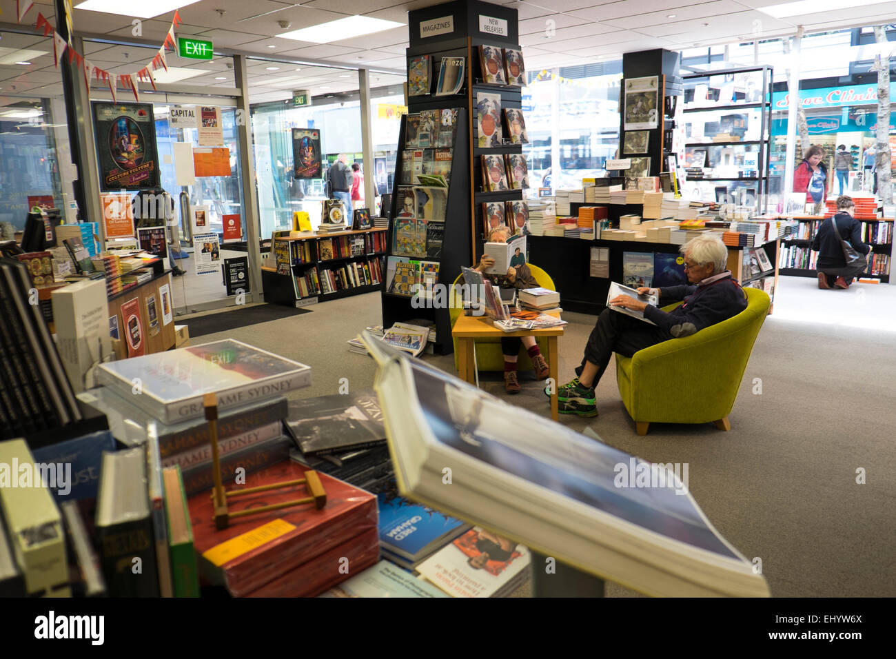 Customers reading inside bookshop, Welington, North Island, New Zealand Stock Photo