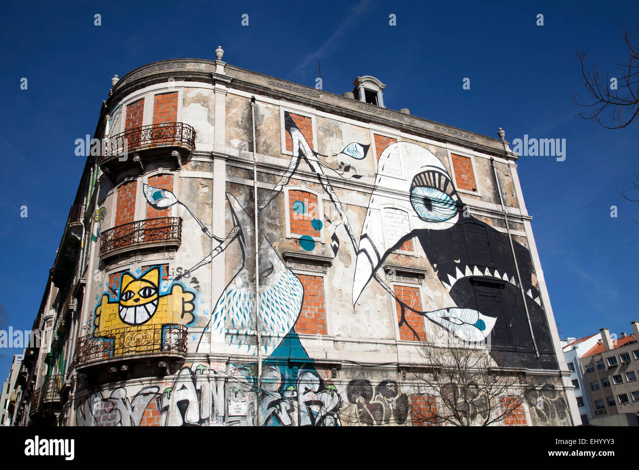 Large Graffiti Murals on Abandoned Buildings on Av. Fontes Perreira de Melo -  Lisbon Portugal Stock Photo