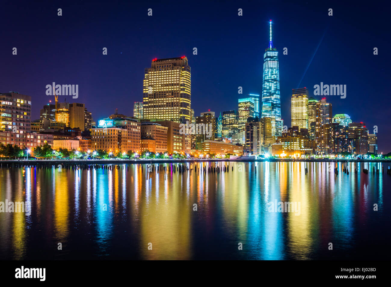 One World Trade Center and Battery Park City at night, seen from Pier 34, Manhattan, New York. Stock Photo