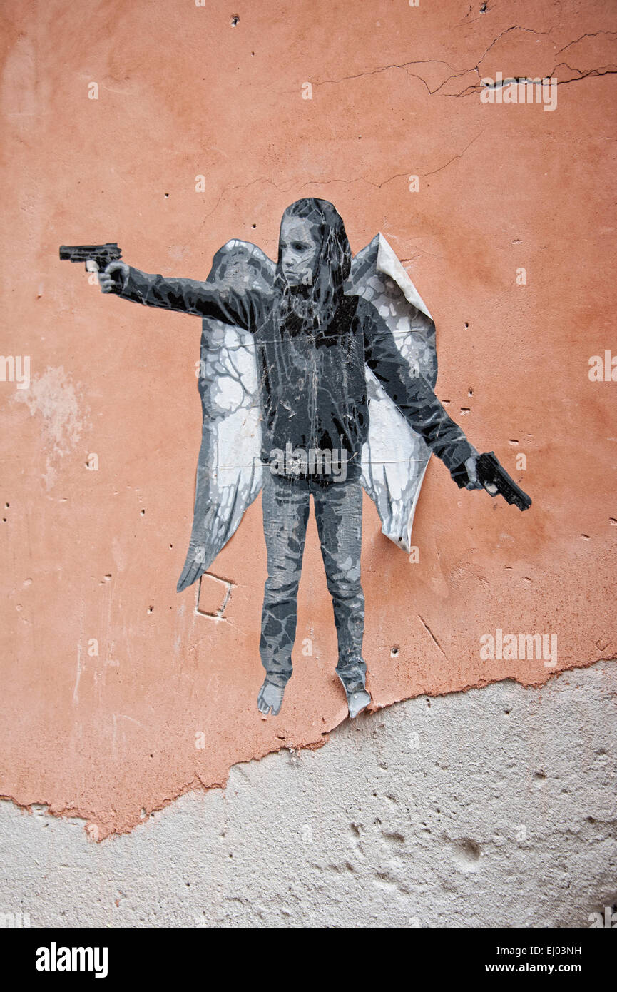 Stencil of a girl with a pistol and angel wings Stock Photo Alamy