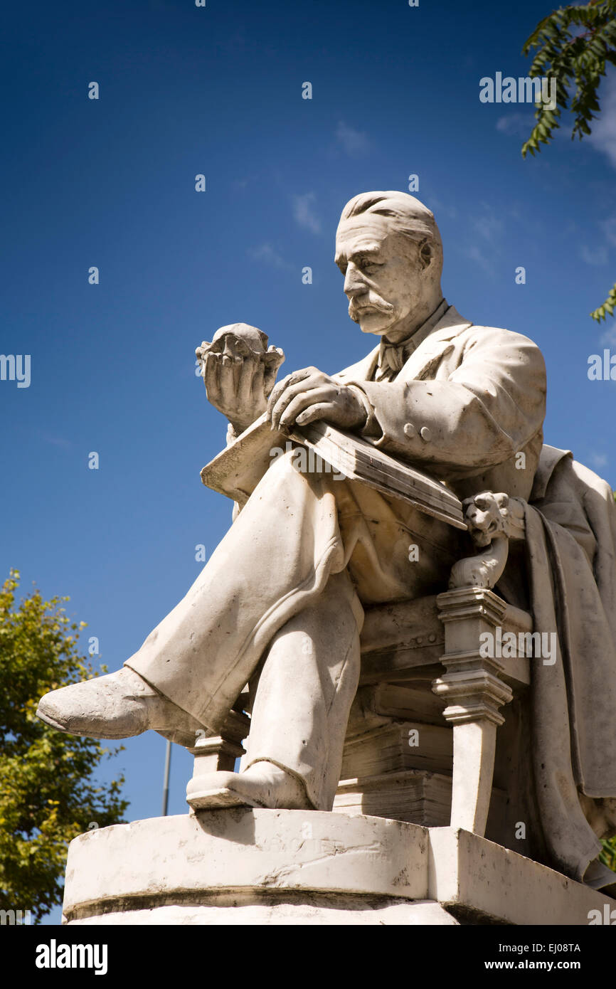 Argentina, Buenos Aires, Cabalito, Parque Centenario, Centenary Park, statue of man studying vegetable Stock Photo