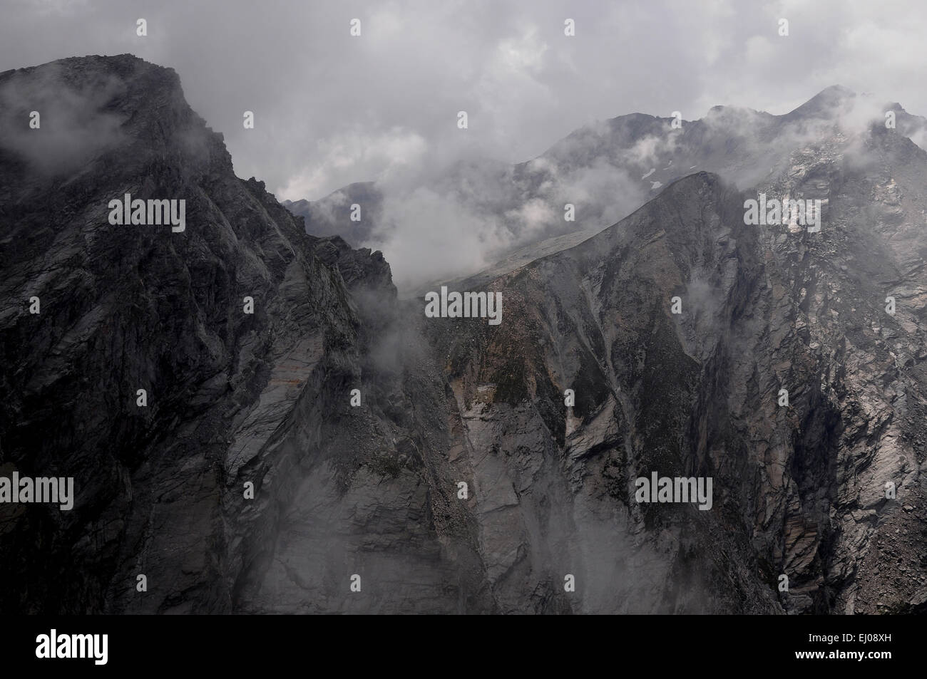 Switzerland, Europe, Ticino, Greina, Parco Adula, Val Malvaglia, Passo del Laghetto, Pizzo Forca, burr, mountains, clouds, fog Stock Photo