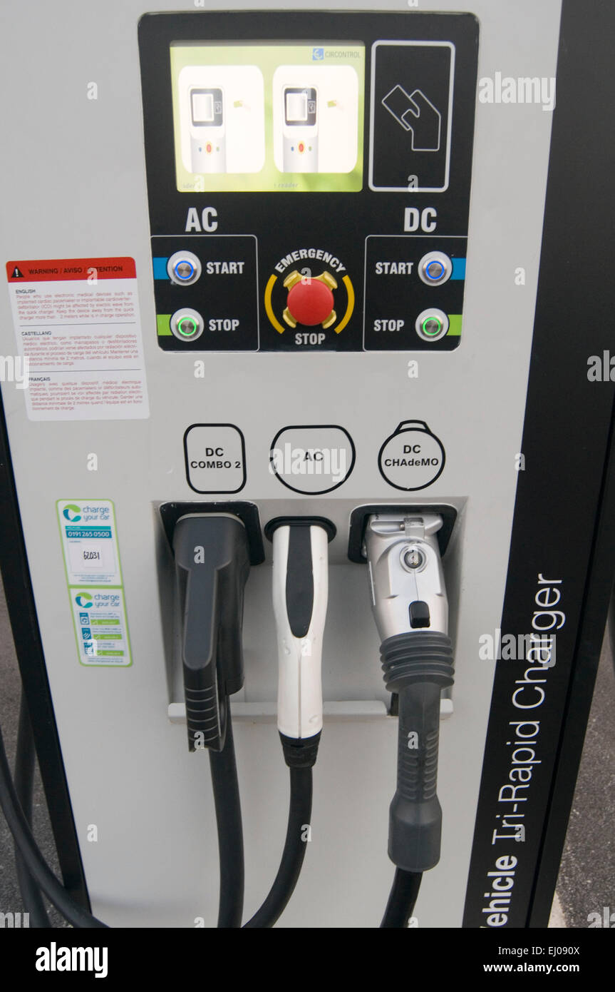 electric car cars recharging point charging charge plug plugging in