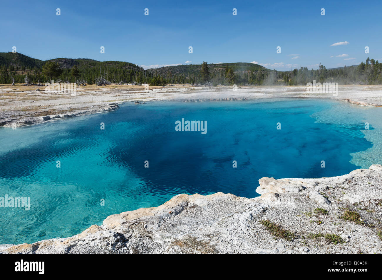 Beautiful blue water of Sapphire Pool, Biscuit Basin, in the Upper Geyser Basin. Yellowstone National Park, Wyoming, USA. Stock Photo