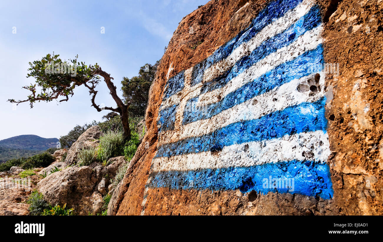 Tree, blue, flag, rock, cliff, flag, Greece, Europe, Crete, nation, national flag, nationalism, patriotism, coat of arms Stock Photo