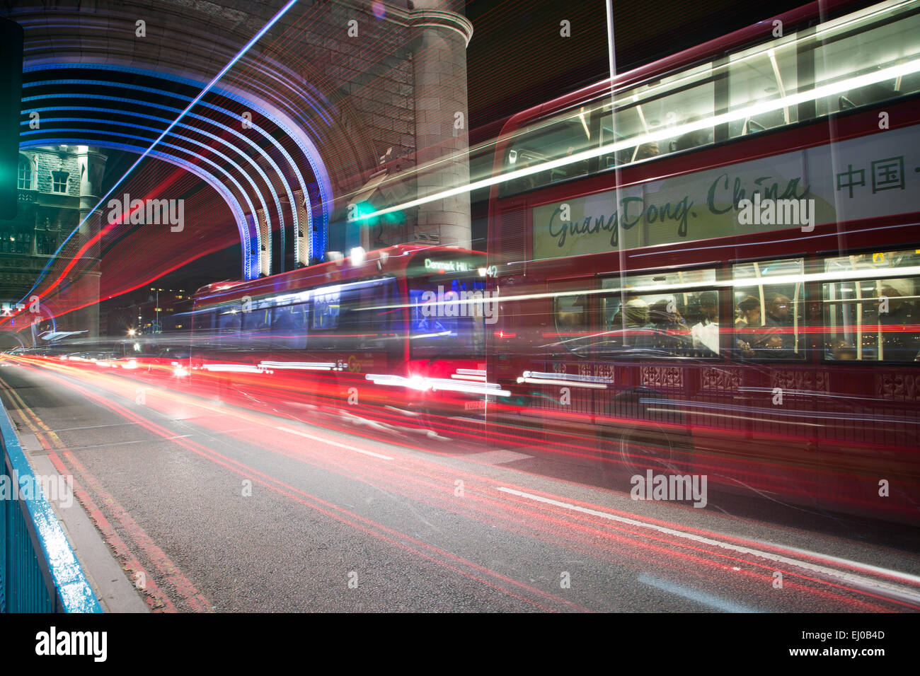 Light trails of London buses on Tower Bridge Stock Photo