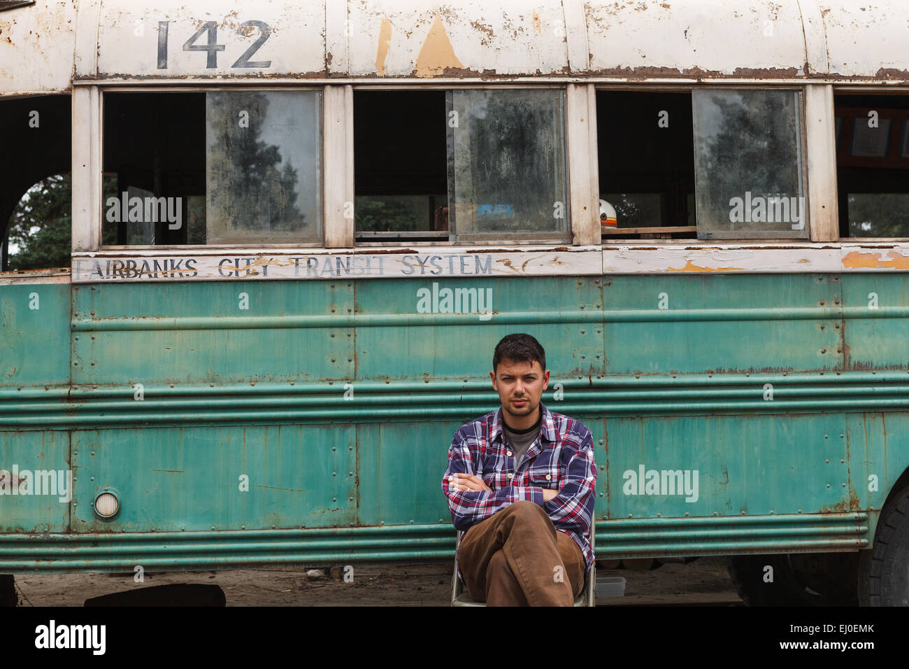 A hiker by bus 142, where Christopher McCandless was found dead, by the Stampede Trail, near Denali National Park, Alaska, USA. Stock Photo