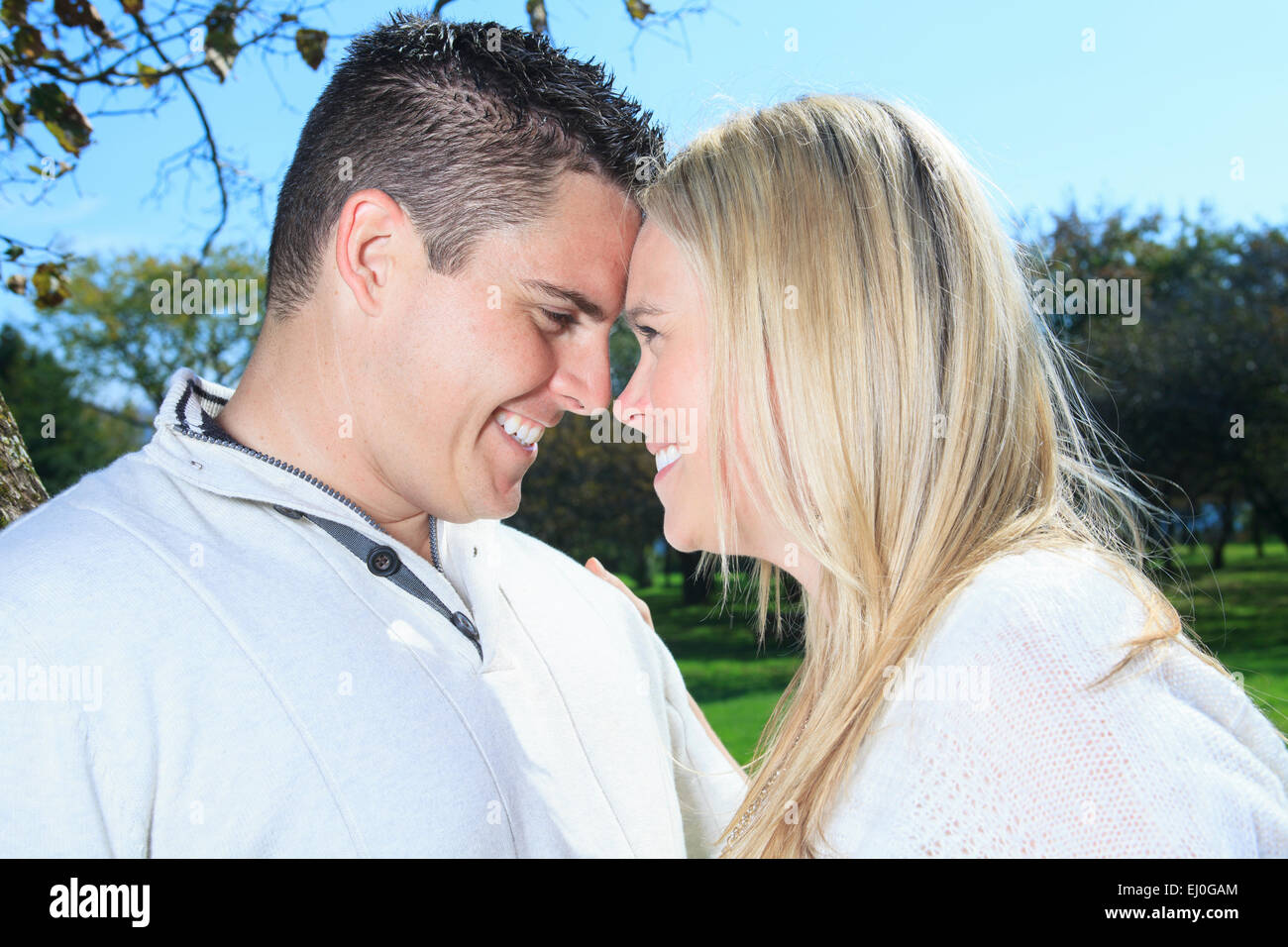A happy autumn fall couple in nature Stock Photo - Alamy
