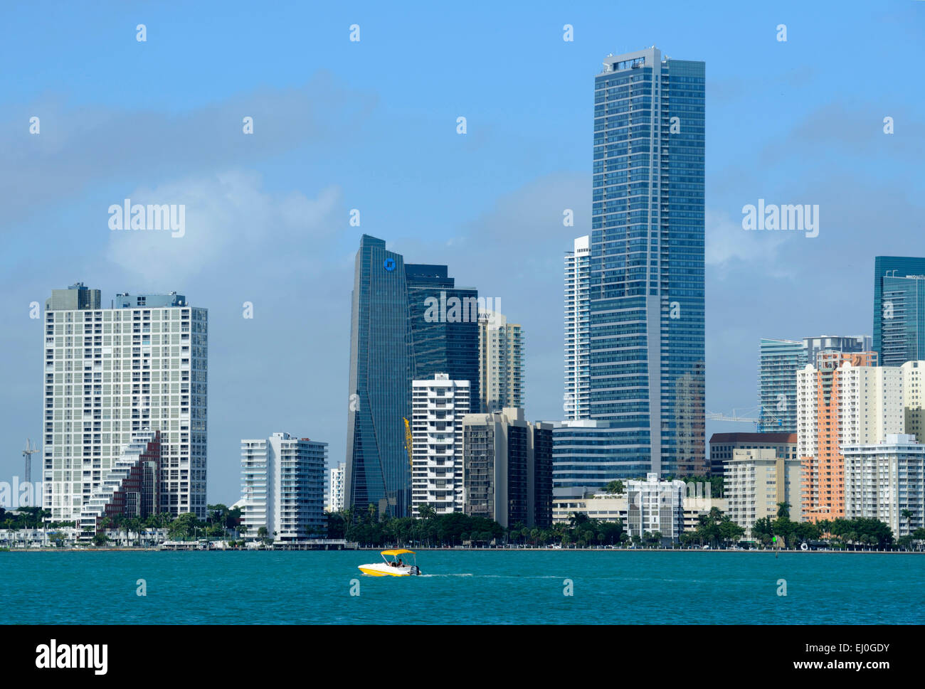 USA, Florida, Dade County, Miami, skyline and yellow boat of downtown Miami Stock Photo