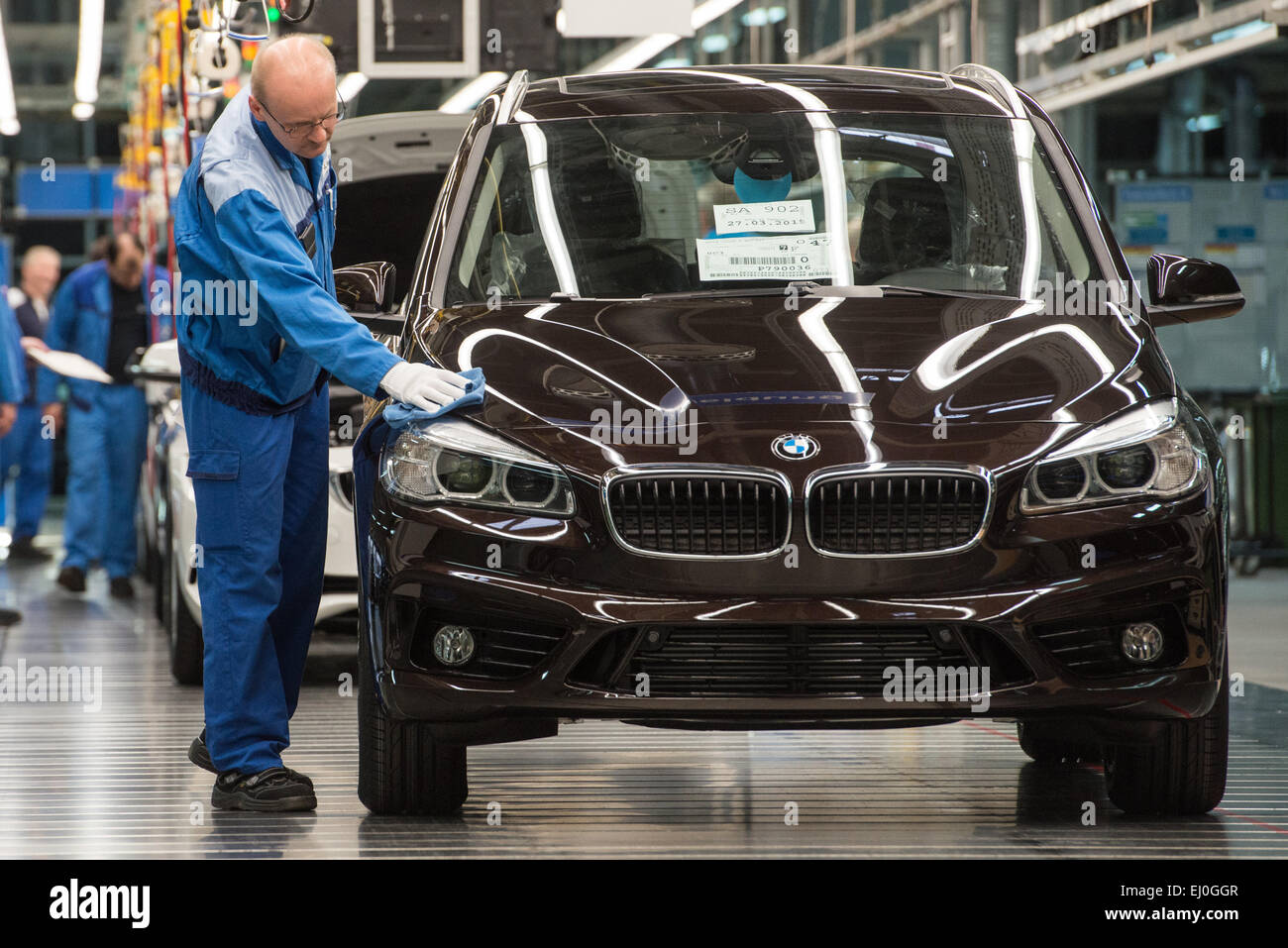 Regensburg, Germany. 13th Mar, 2015. A staff member works on the