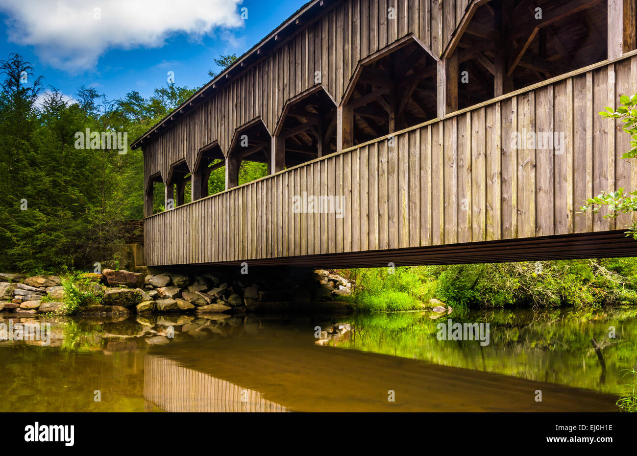 The covered bridge above High Falls, in Dupont State Forest, North Carolina. Stock Photo