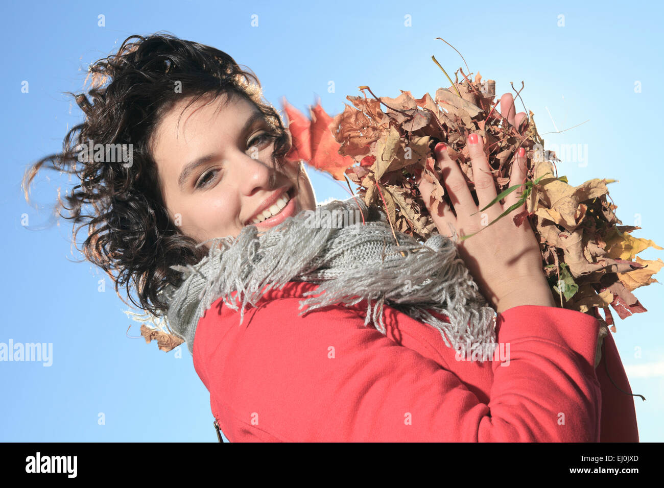 A young girl walking in autumn park Stock Photo - Alamy