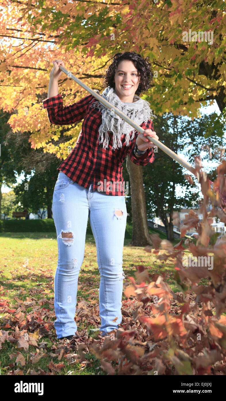 A young girl walking in autumn park Stock Photo - Alamy