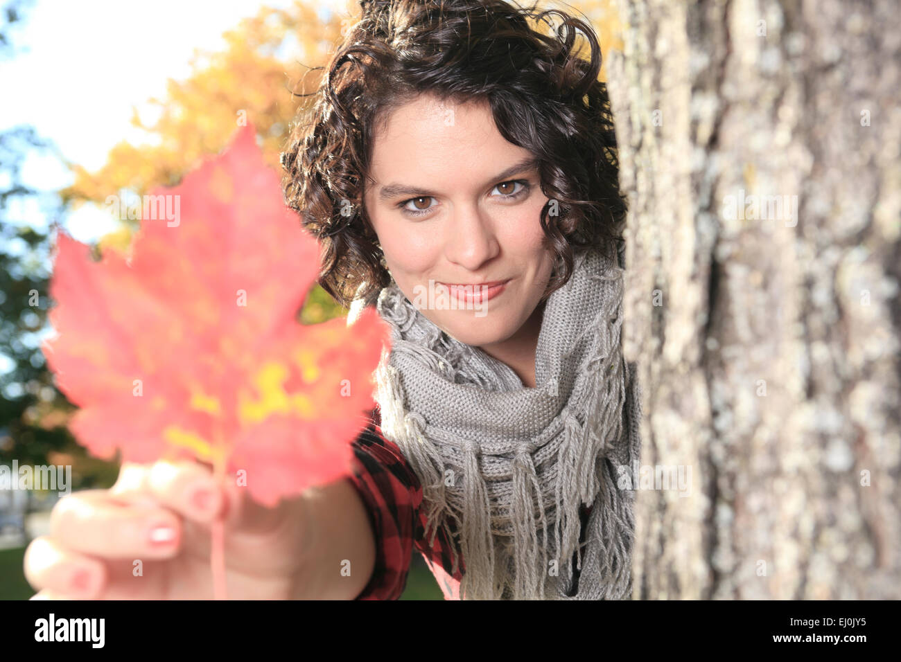 A young girl walking in autumn park Stock Photo - Alamy