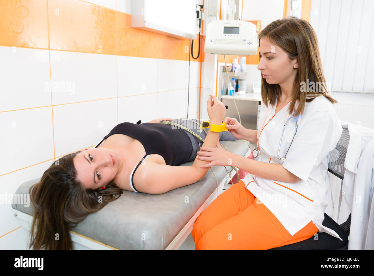Patient under electrocardiogram procedure in a clinic Stock Photo