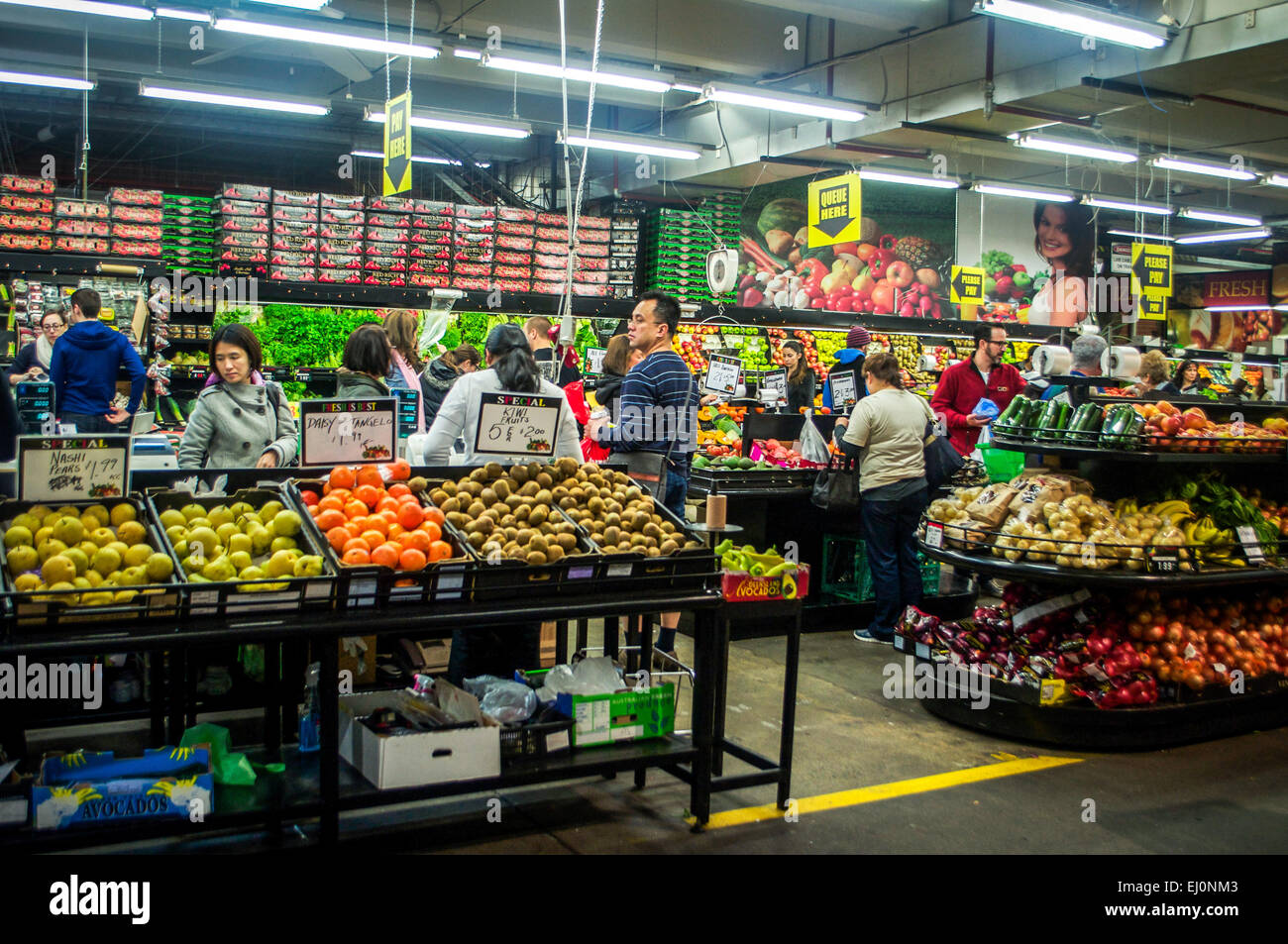 People shopping for produce at the South Melbourne Markets on a busy