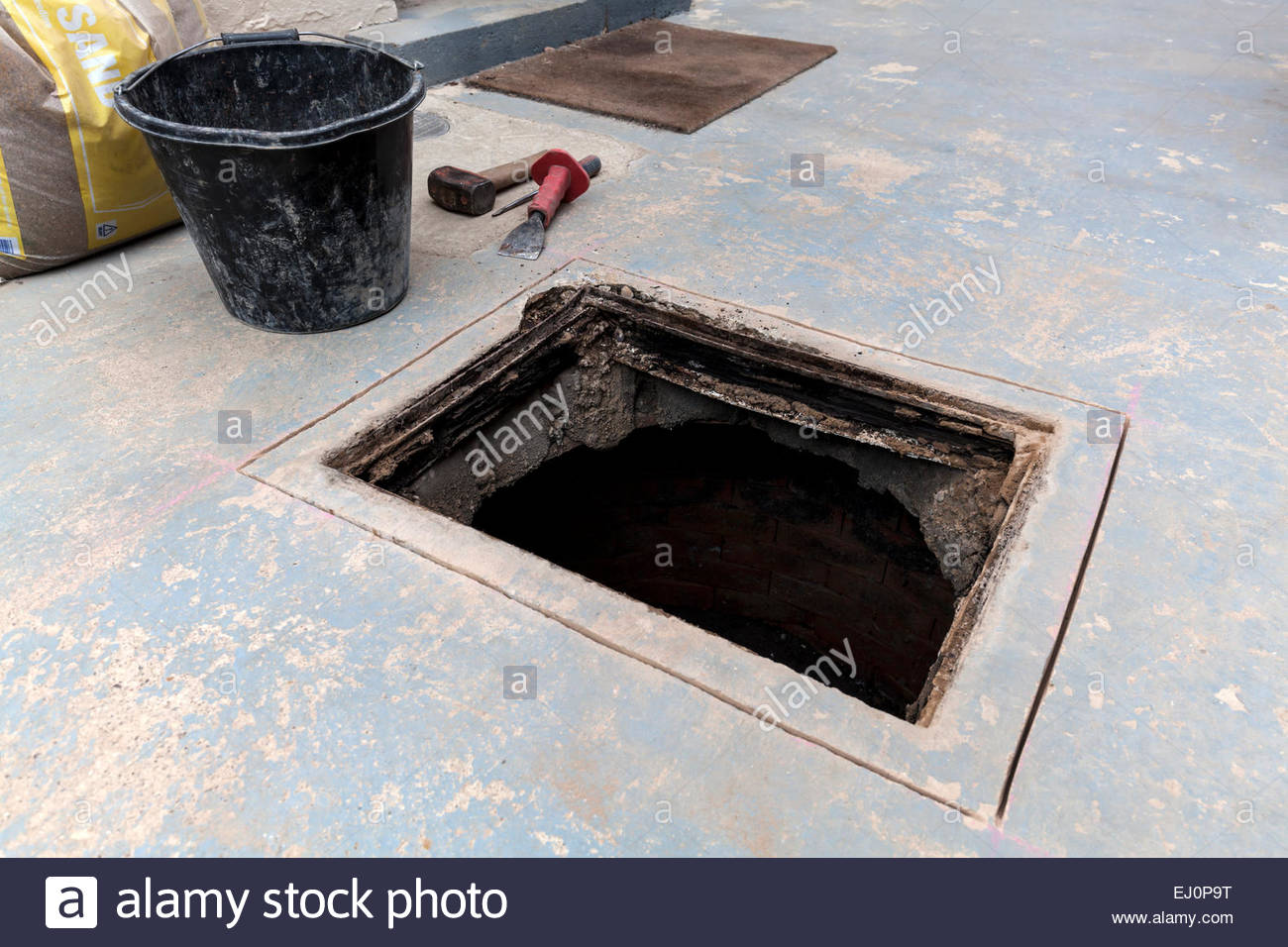 Cutting And Replacing Manhole Cover Frame Stock Photo