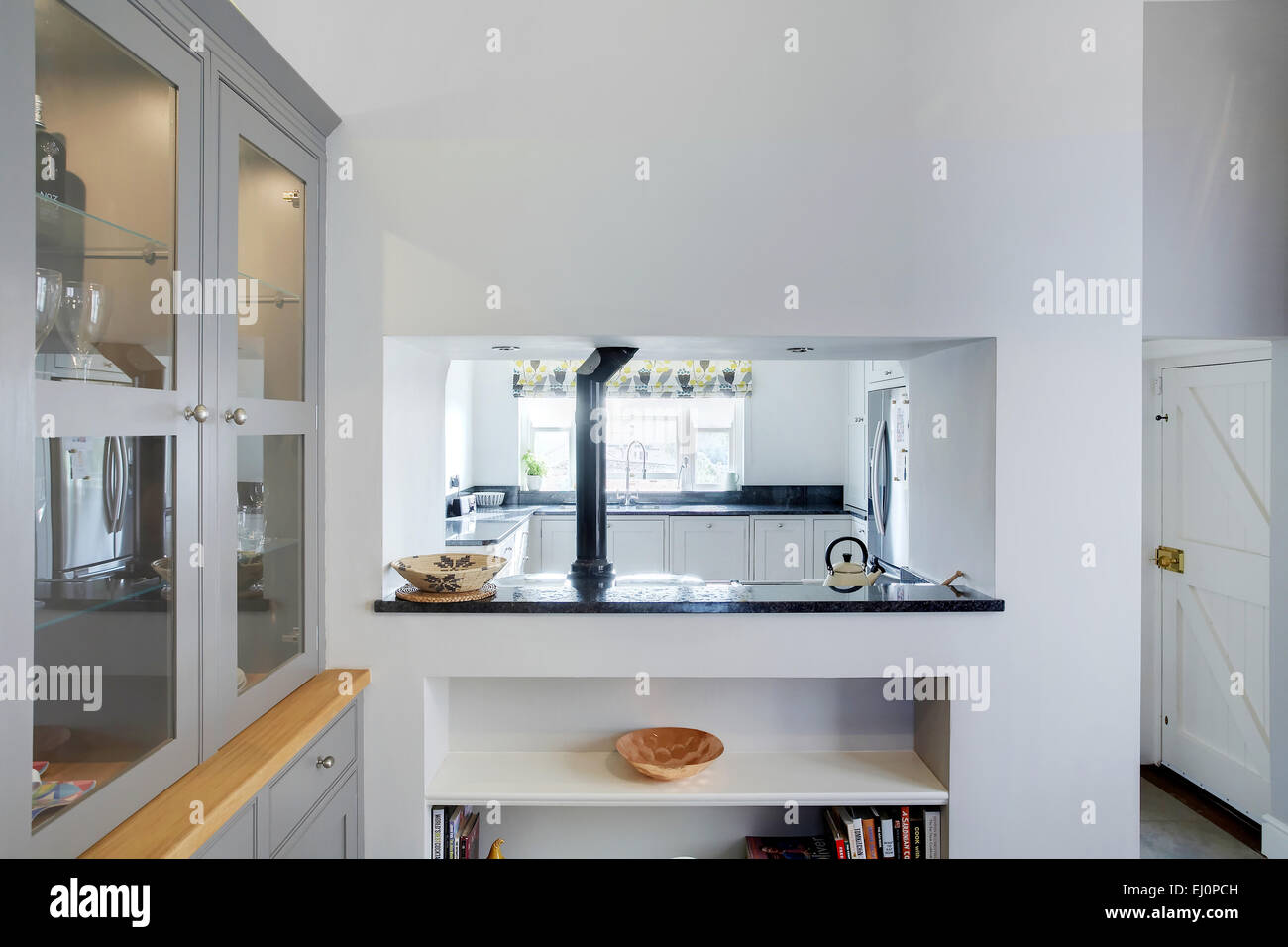 A serving hatch in a modern kitchen in a home in the UK Stock Photo
