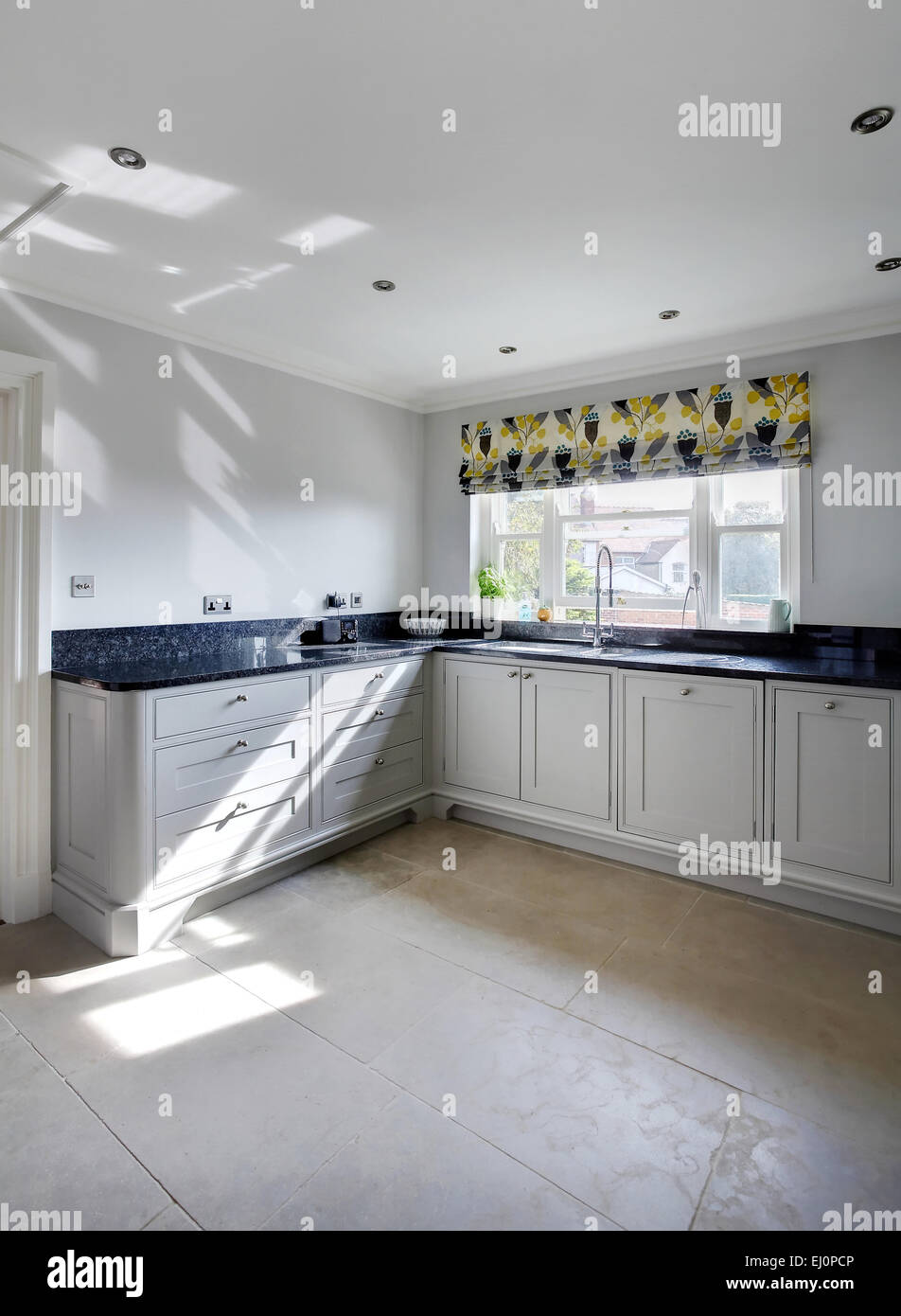 White Kitchen Units With Black Worktop High Resolution Stock ...