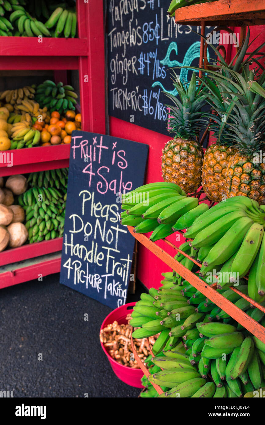 Pineapples and other fruits for sale at a roadside stand on Maui Hawaii