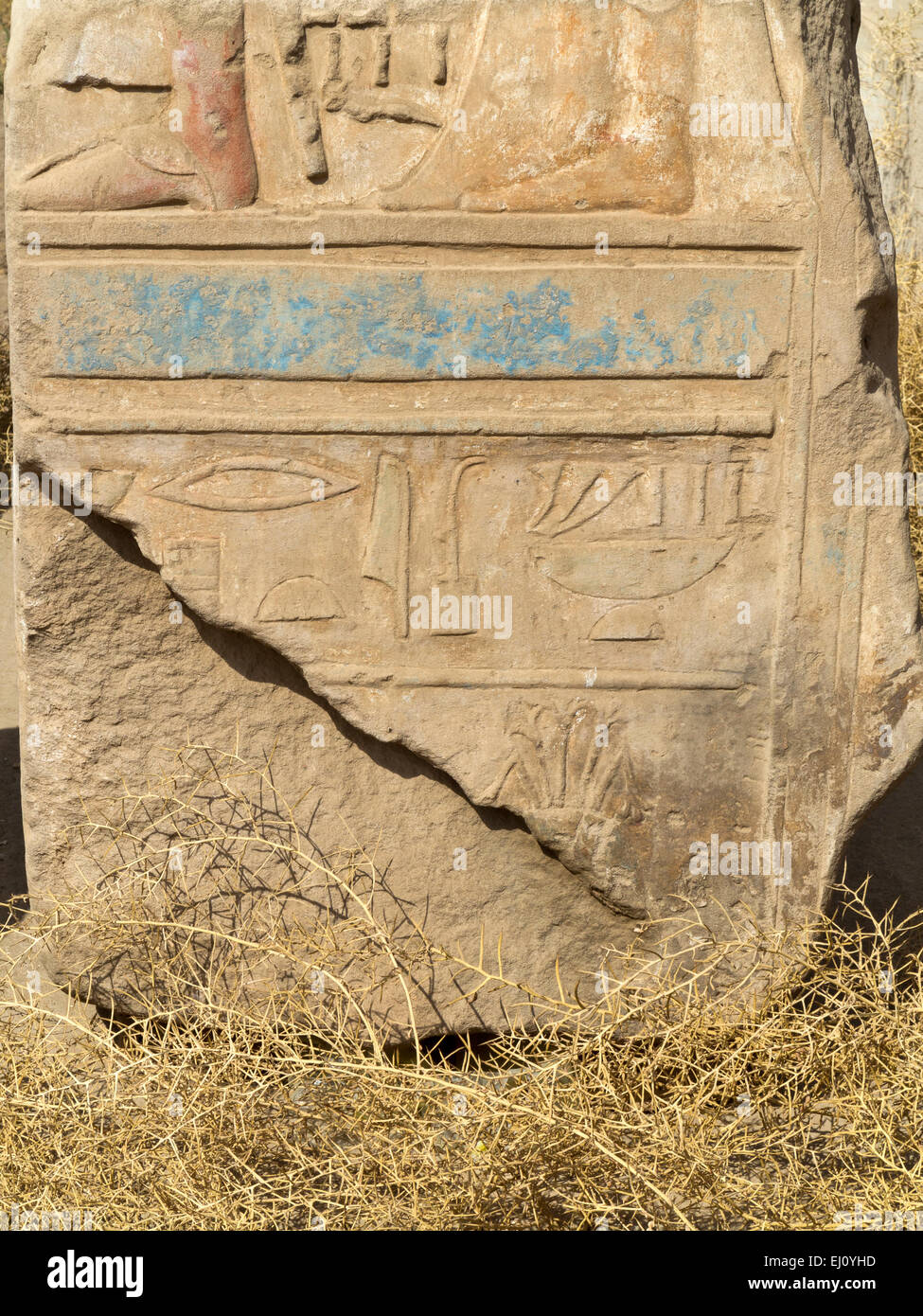 Close up of relief work on some of the broken blocks in magazines at the Temple at Karnak, Luxor Egypt Stock Photo