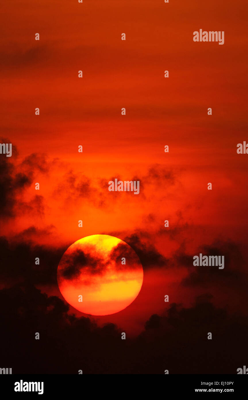 Sunrise, Sun, clouds, orange, round, vertical Stock Photo