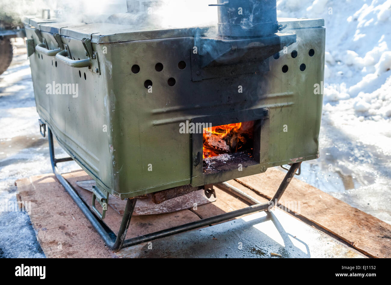 Cooking food on a military field kitchen in field conditions Stock