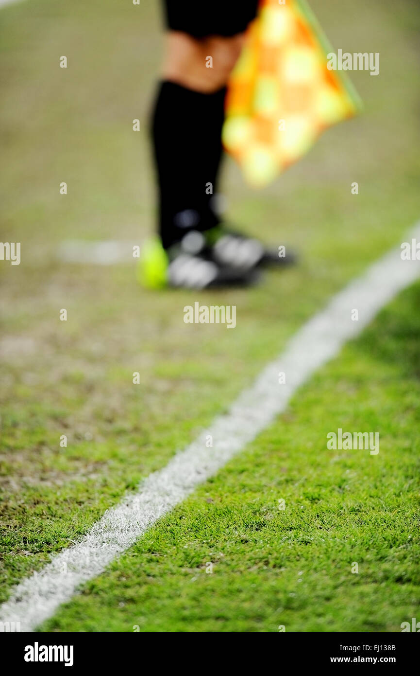 Soccer field detail with assistant referee on the sideline in background Stock Photo