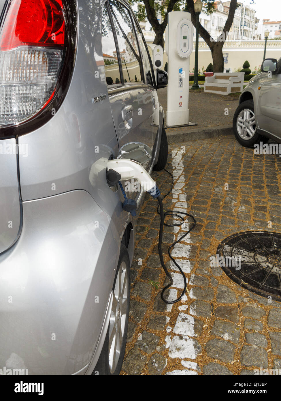 Peugeot Ion full electric car at a charging station in Portugal Stock Photo