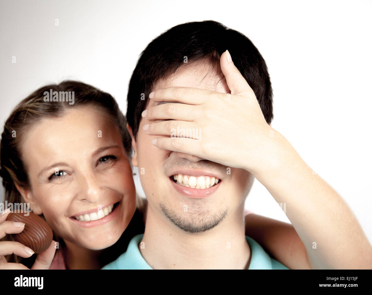 Woman giving to a man a surprise Stock Photo