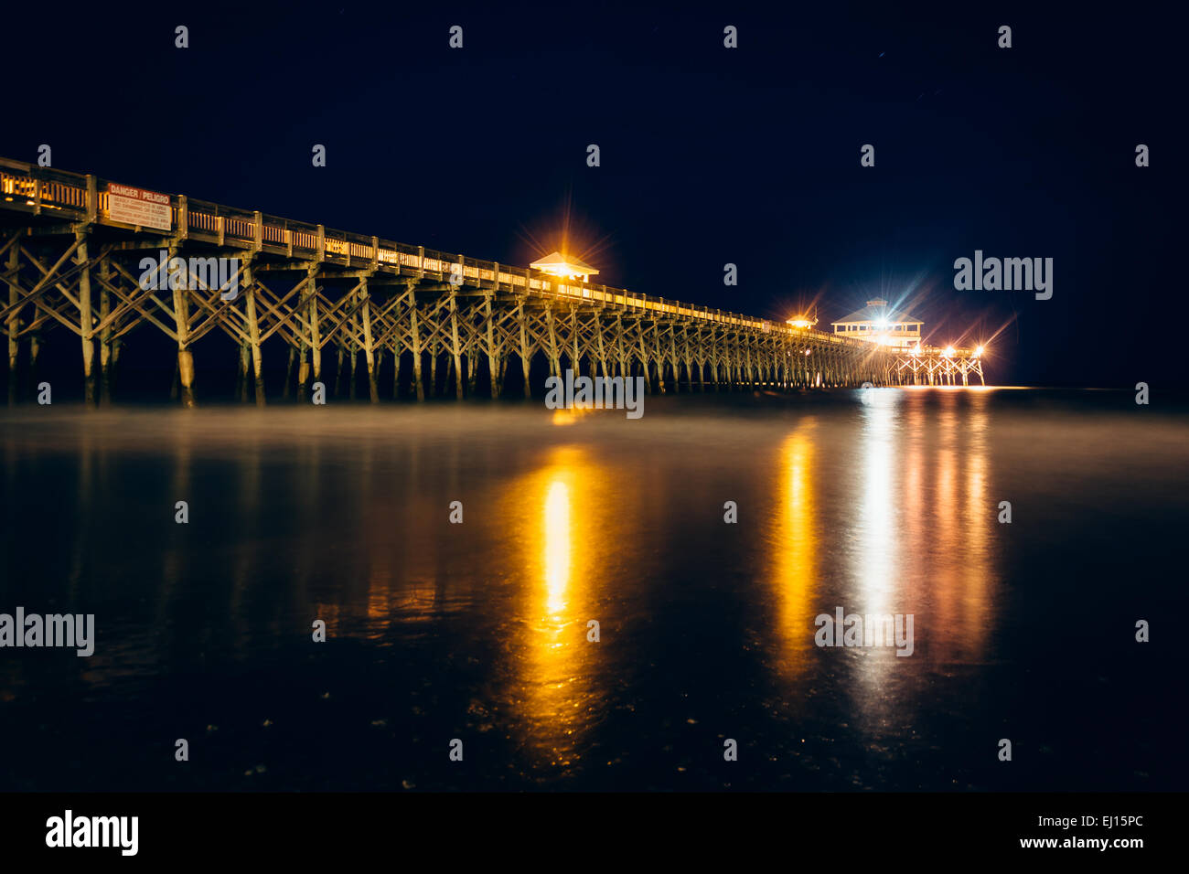 The fishing pier at night, in Folly Beach, South Carolina Stock Photo