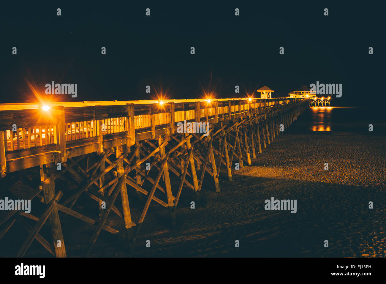 The fishing pier at night, in Folly Beach, South Carolina Stock Photo