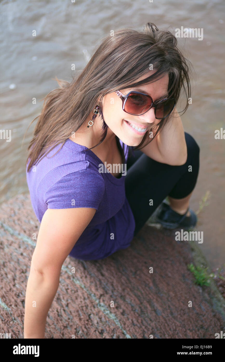 A Beautiful girl portrait outdoor on the water border Stock Photo - Alamy