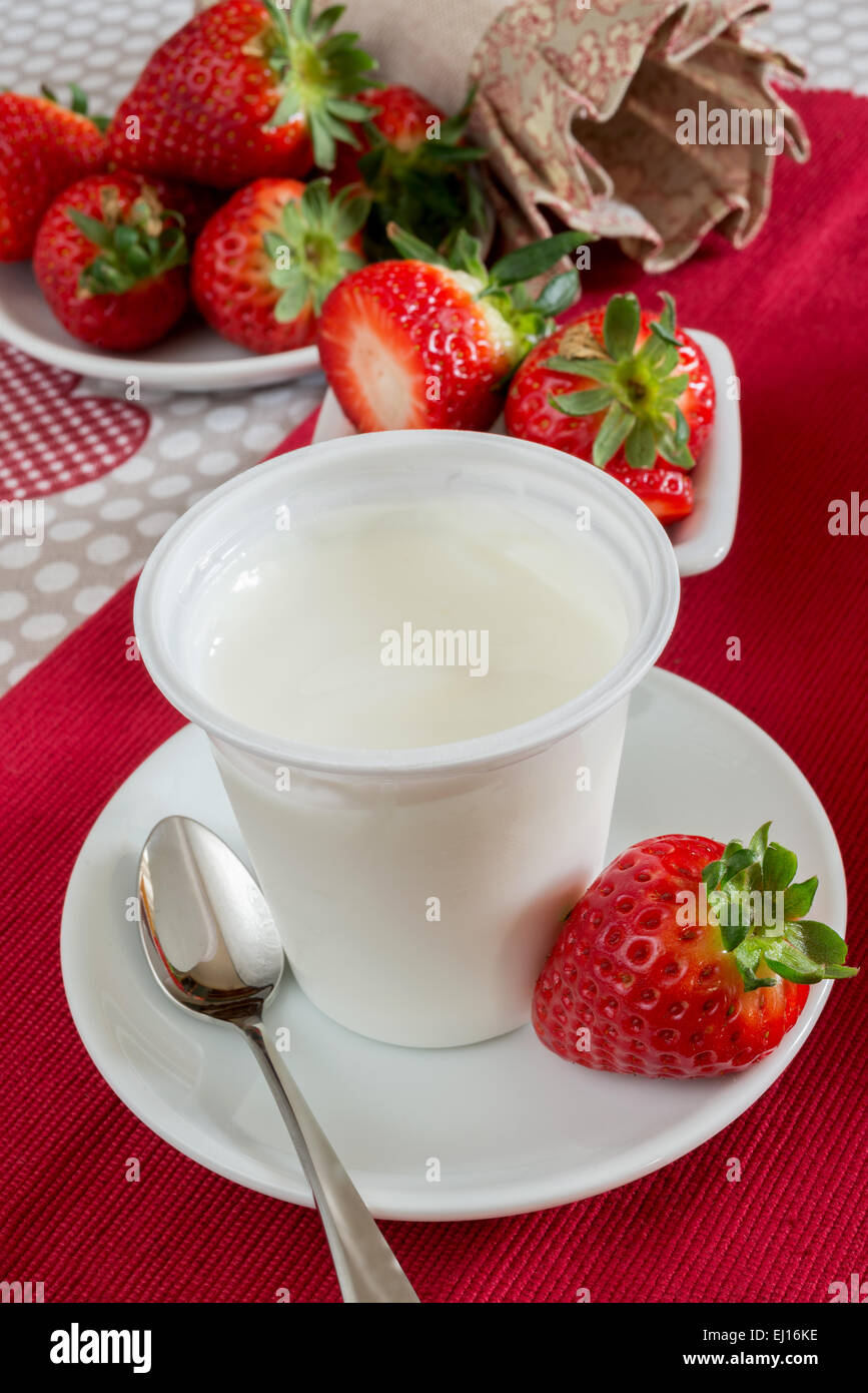 lowfat plain yogurt creamy strawberry flavor Stock Photo Alamy
