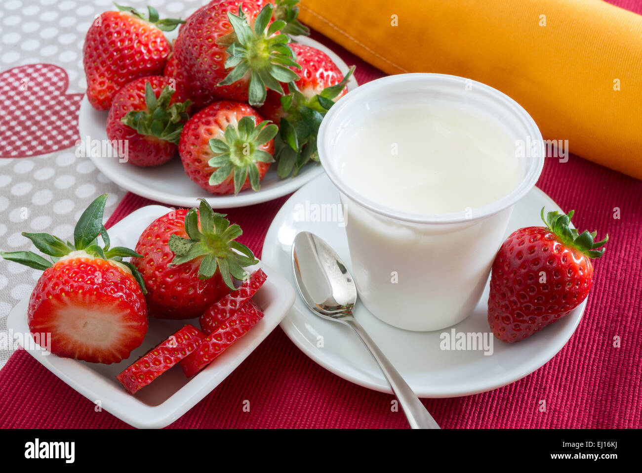 lowfat plain yogurt creamy strawberry flavor Stock Photo Alamy