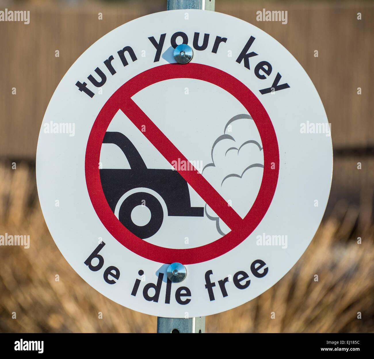 A sign recommending motorists, to not idle their vehicles because of pollution Stock Photo