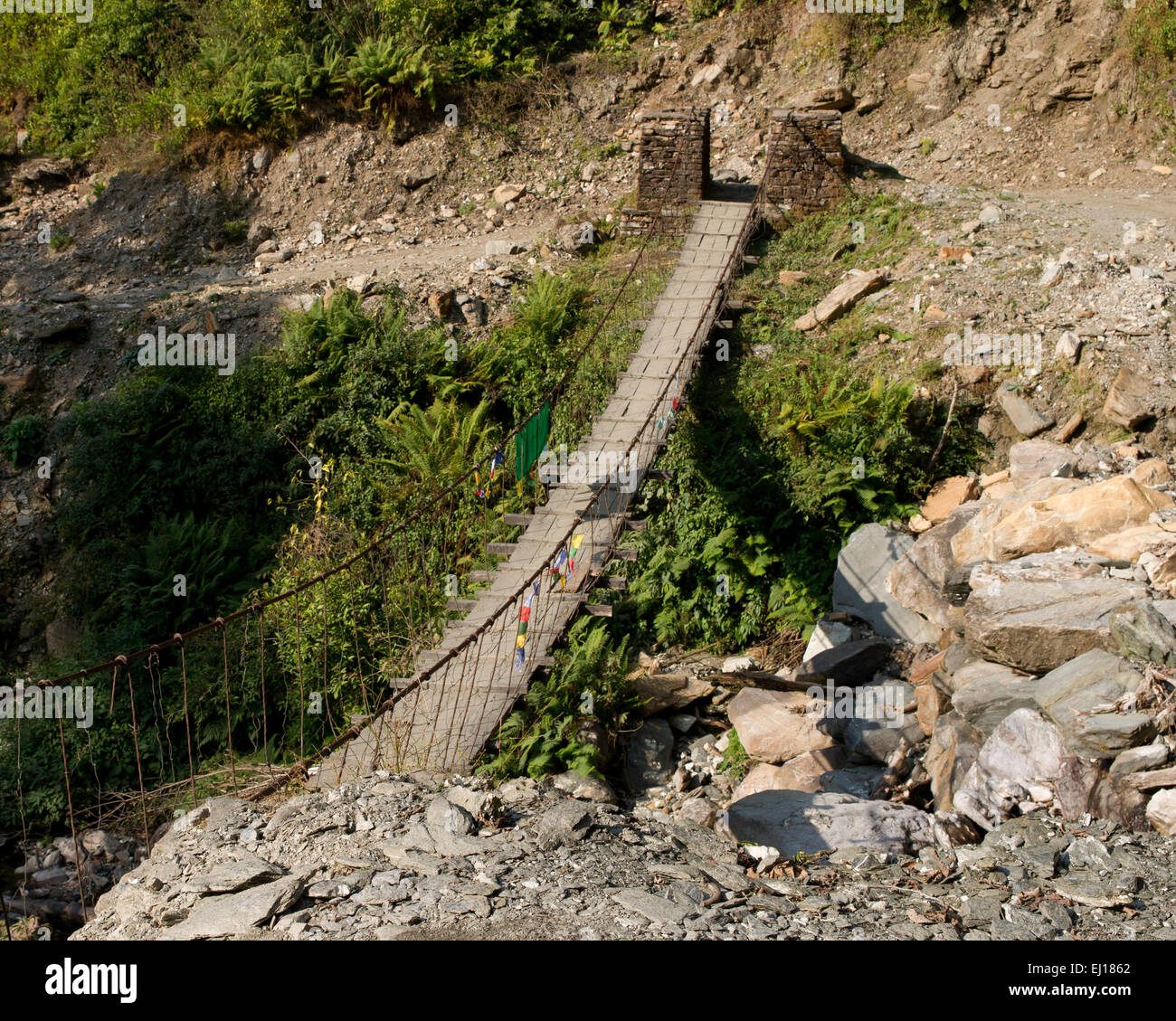 Rope bridge across a in Nepal Stock Photo Alamy