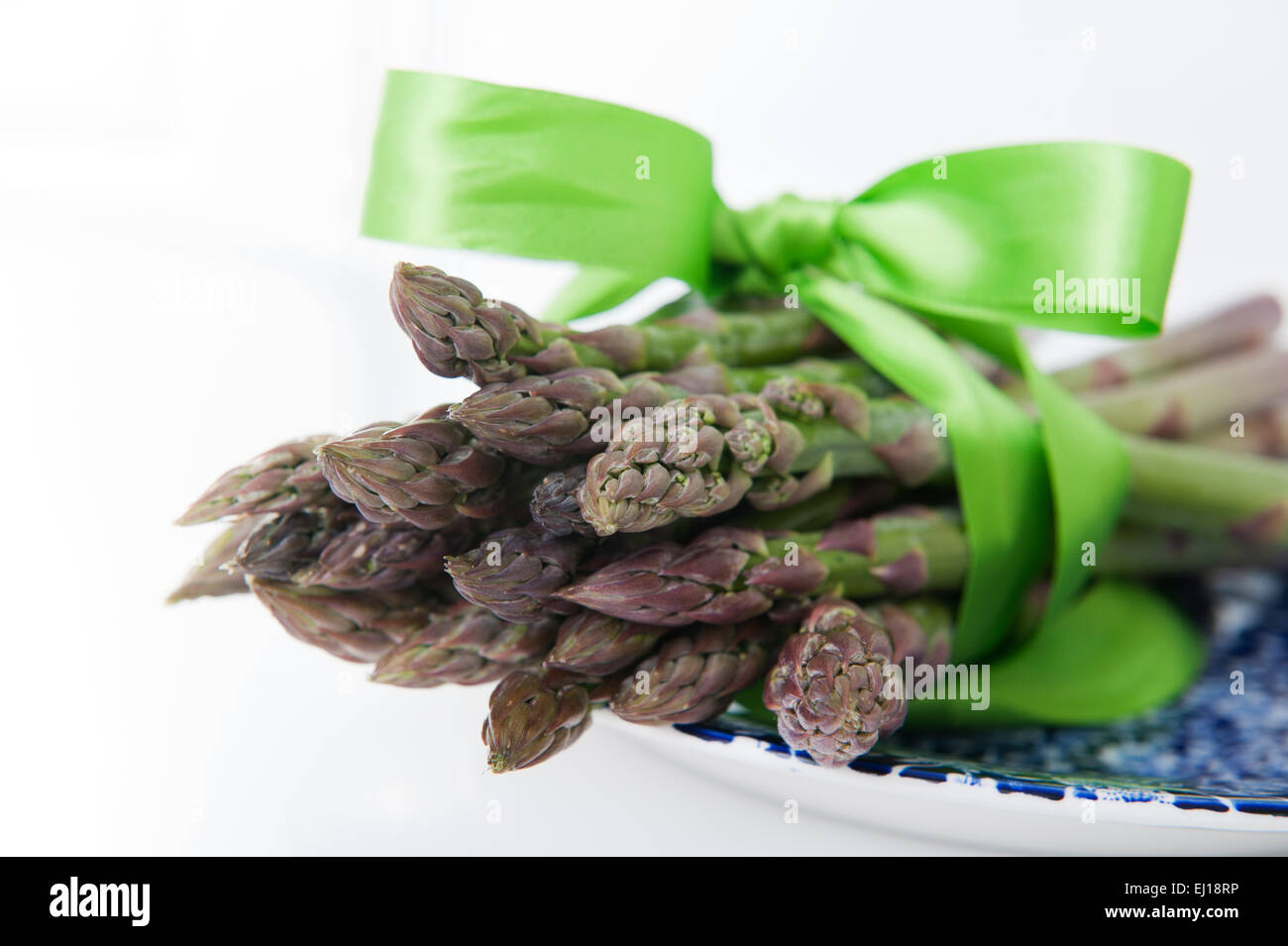 Bunch of Green Asparagus studio shot with a ribbon Stock Photo