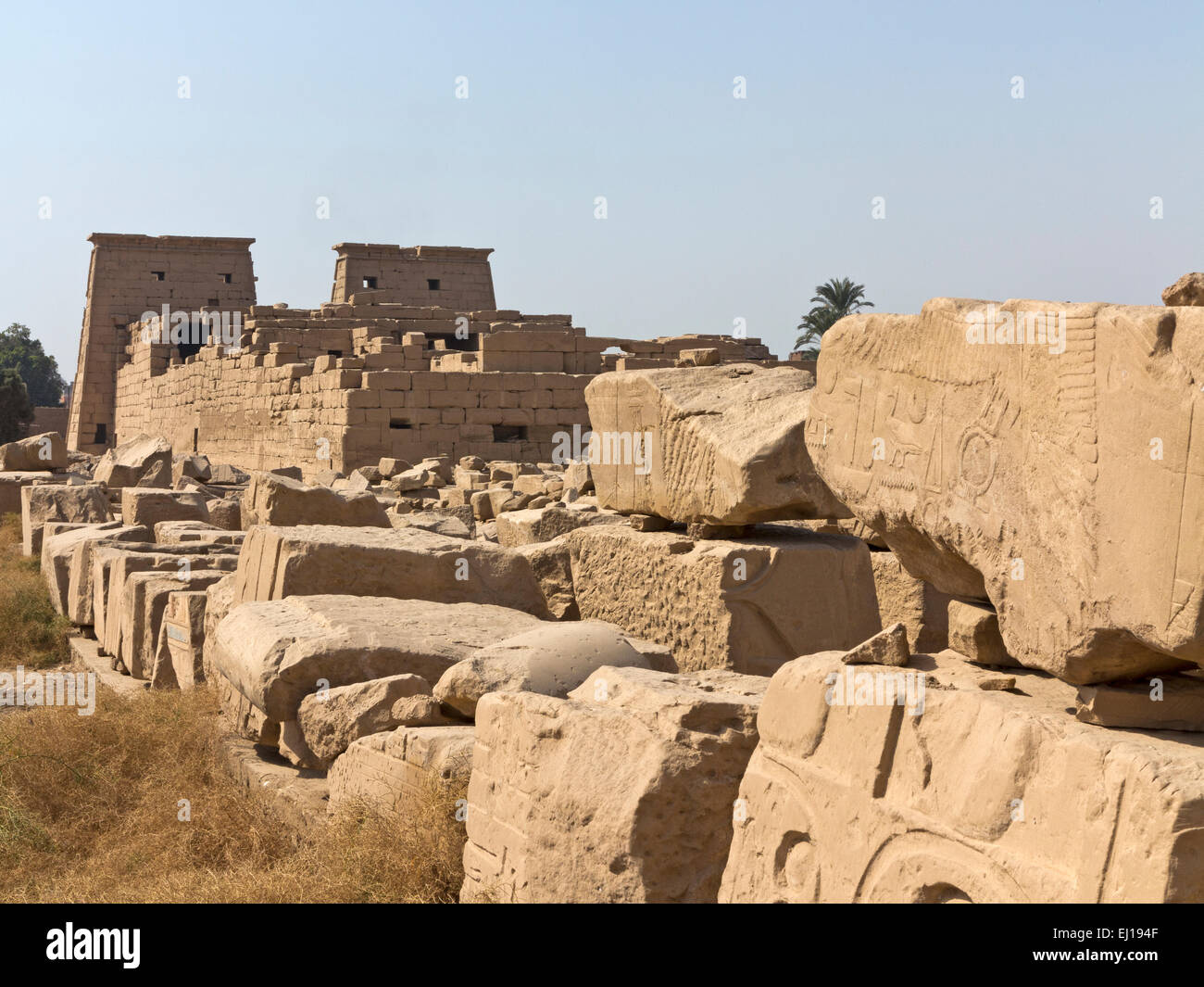 View over magazines of broken blocks to the Temple of Khonsu at the Temple of Karnak, Luxor Egypt Stock Photo