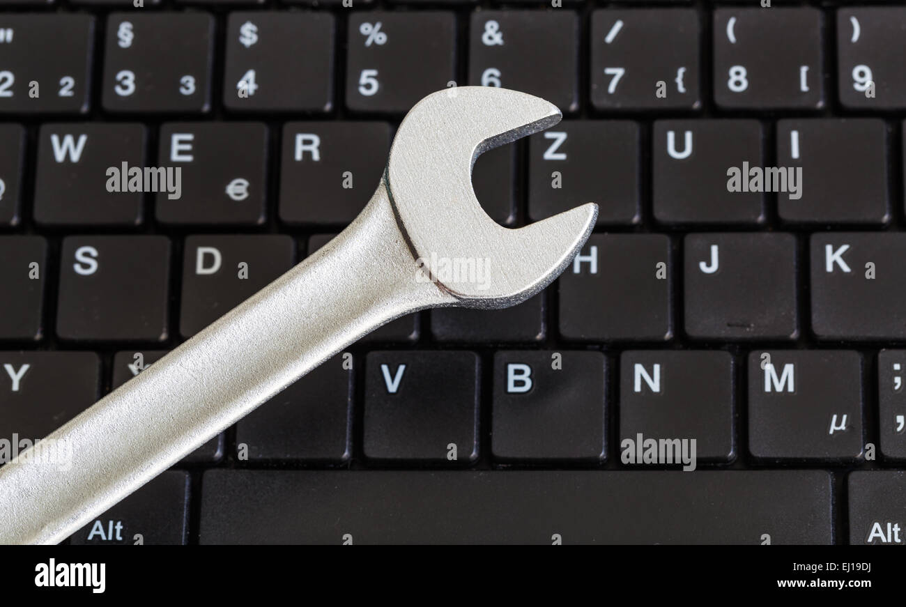 Wrench chrome and keyboard. Stock Photo