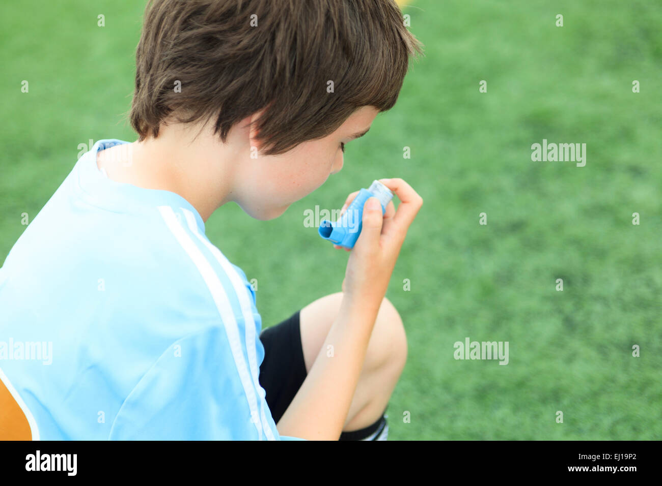 Footballer Using Inhaler A young soccer player inhalator Stock Photo - Alamy