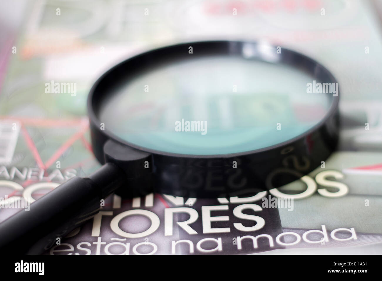 Close up view of a magnifying glass on a table Stock Photo - Alamy