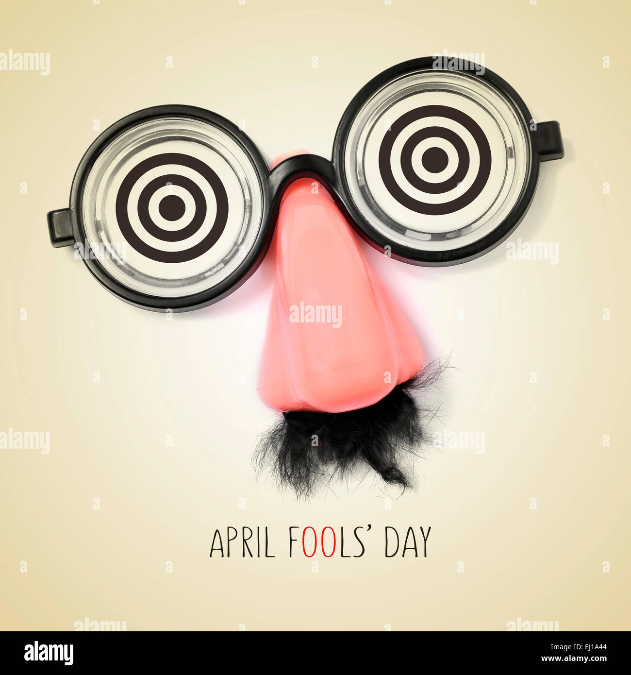 fake eyeglasses, nose and mustache and the sentence april fools day