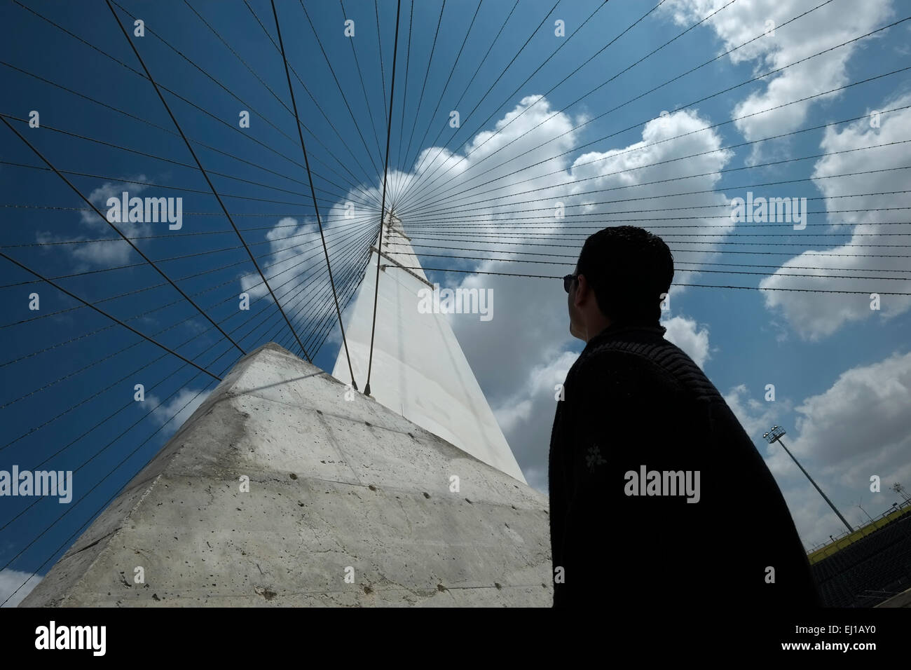 Man inspecting the structure of the modern amphitheater at Nahal Beer