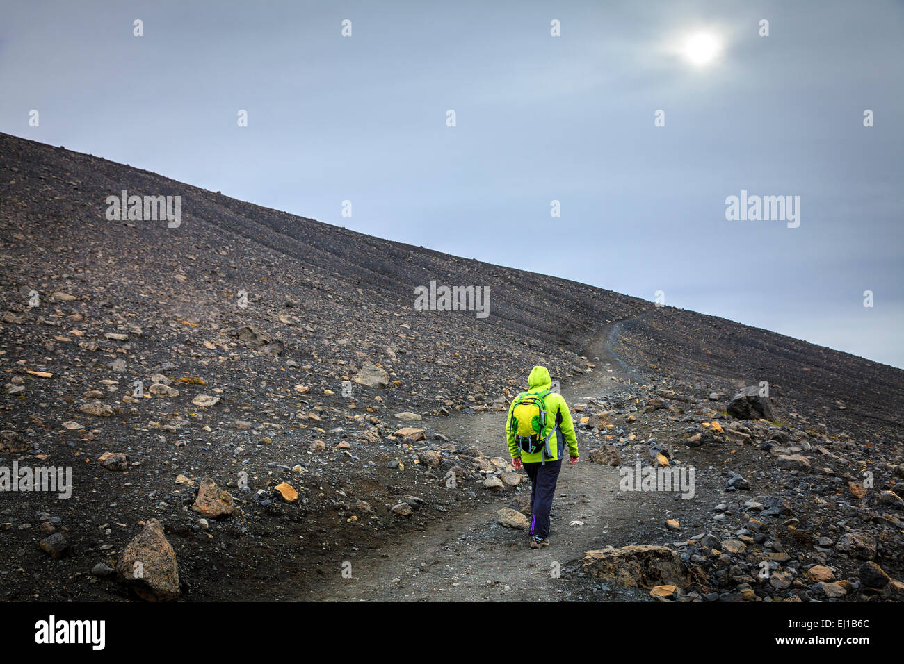 Woman is taking a trail to the top of the Hverfjall crater in Northern Iceland Stock Photo