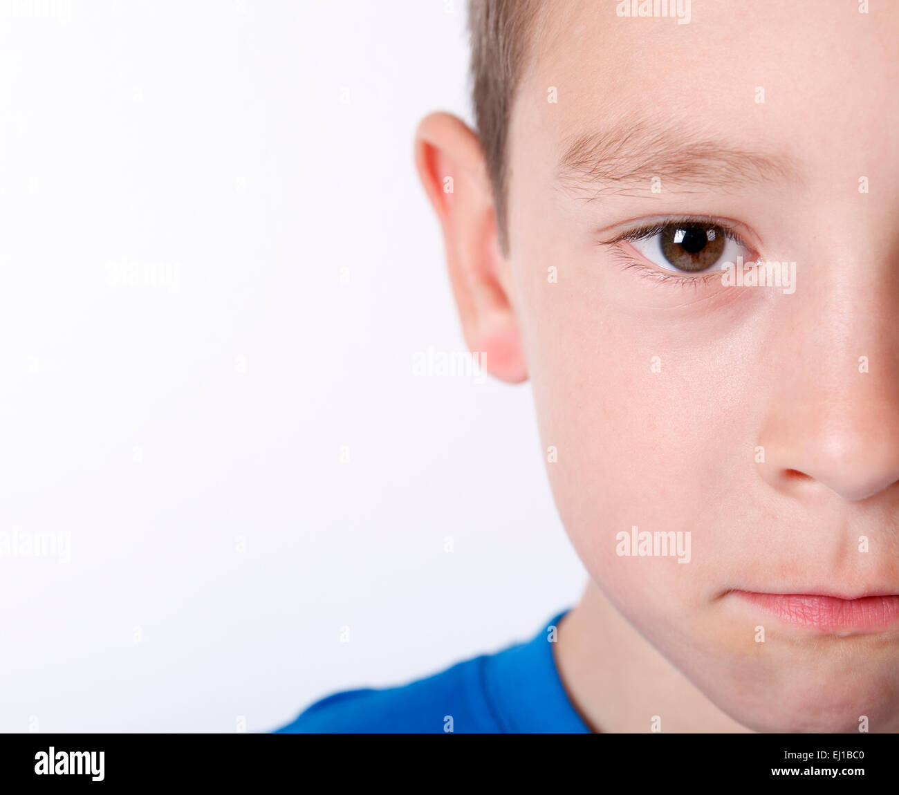 Photo of adorable young happy boy looking at camera Stock Photo - Alamy