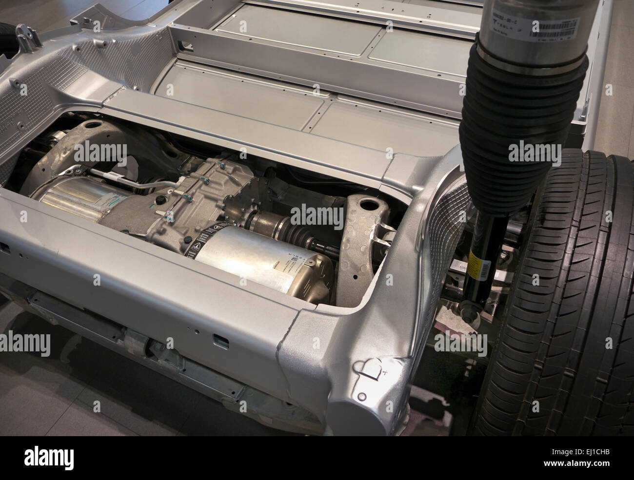 Cutaway of iconic 2015 Tesla Model S lightweight chassis floor displaying electric engine power unit and space for batteries Stock Photo