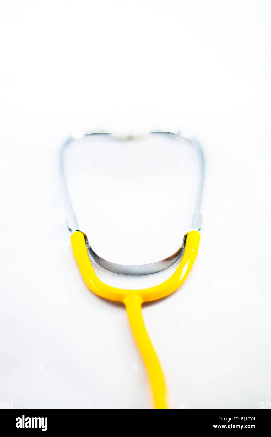 Yellow stethoscope with isolated white Stock Photo Alamy