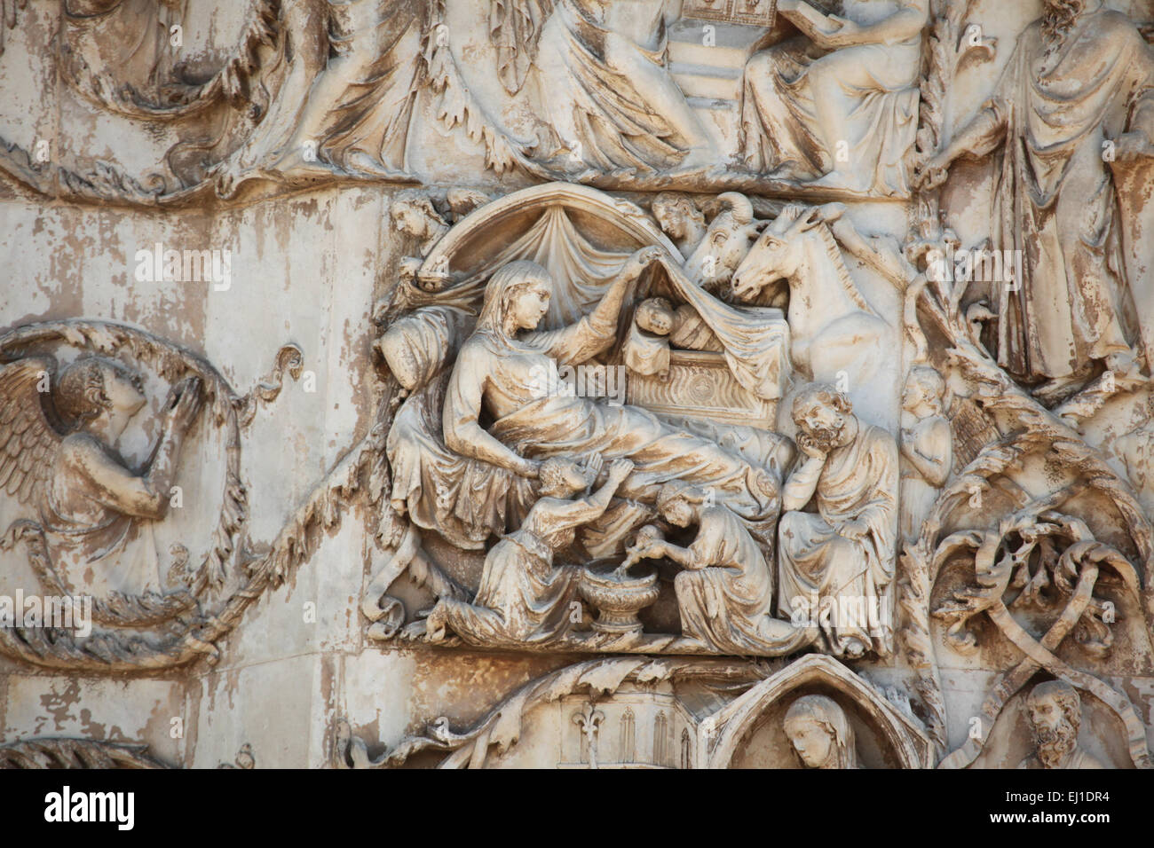 The Nativity. Early Renaissance relief by Italian sculptor Lorenzo Maitani on the Orvieto Cathedral, Italy. Stock Photo