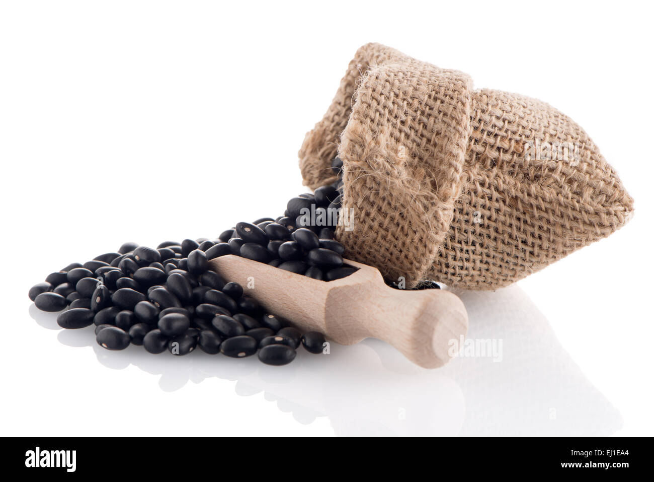 Black beans bag with wooden scoop on white background Stock Photo Alamy